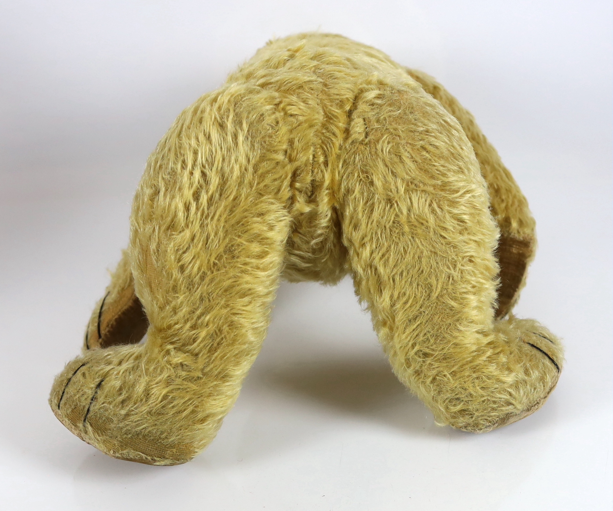 A large 1930's Chiltern bear, 53cm, with replaced nose stitching, some hair loss generally